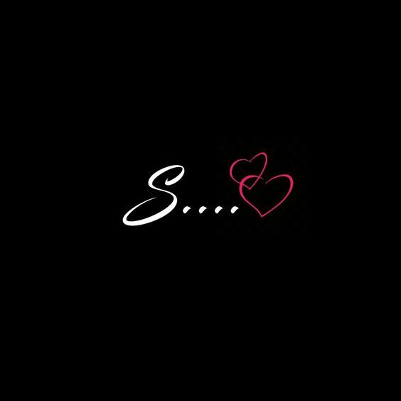 the word b is written in white and red ink on a black background with two hearts