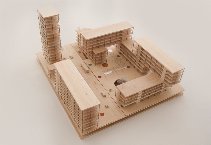 an architectural model of a building made out of wood