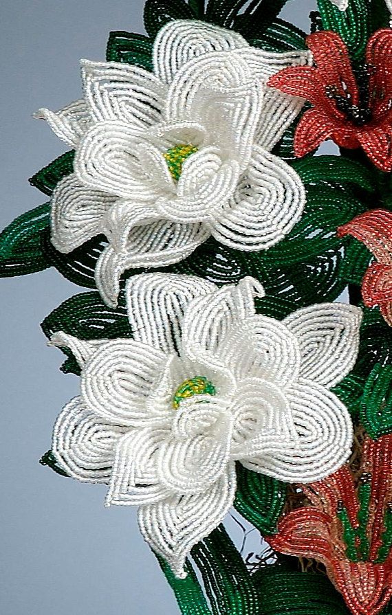 some white and red flowers are in a vase