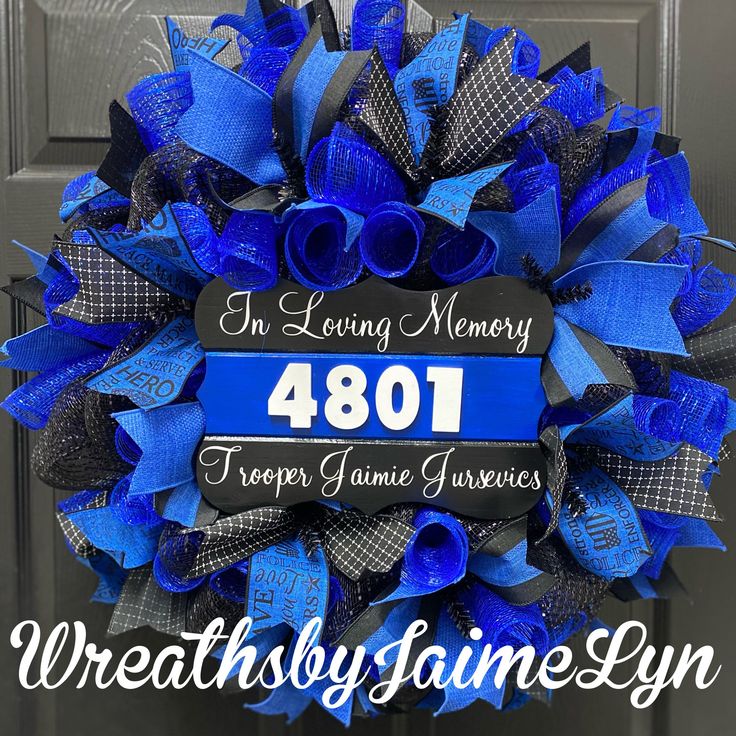 a blue and black wreath with the words in loving memory, forty year game memories