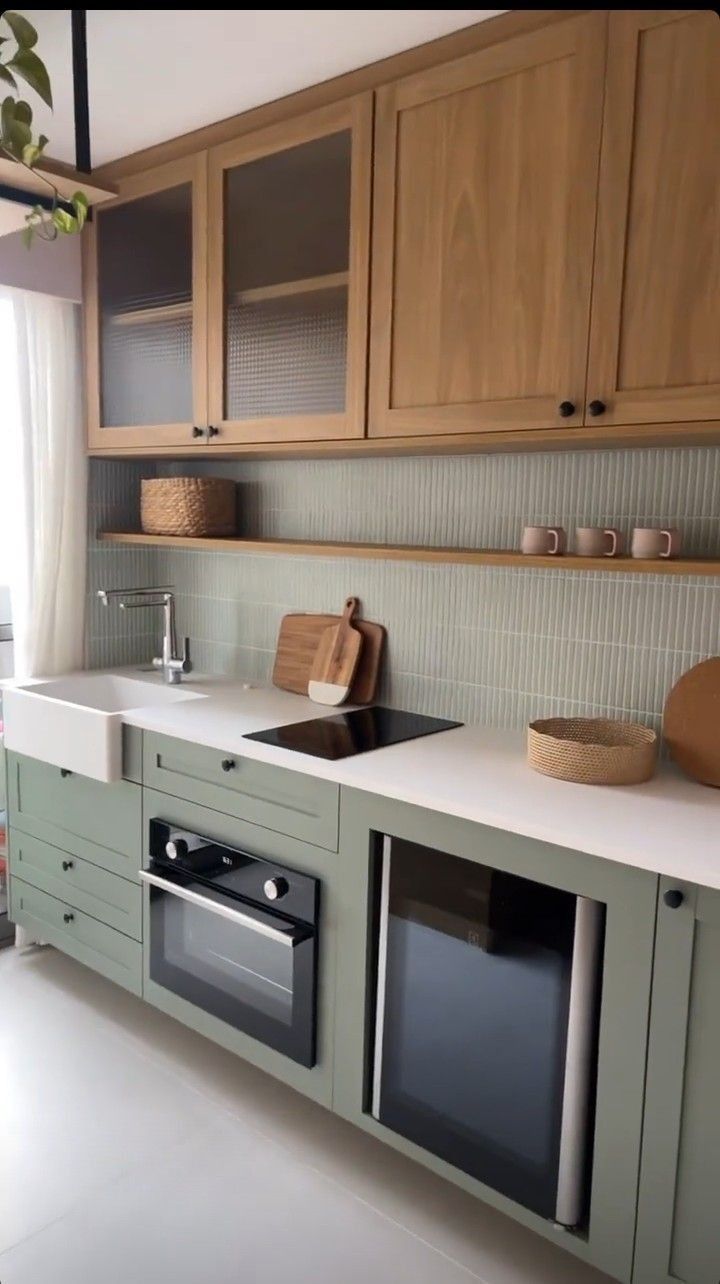 a kitchen with wooden cabinets and white counter tops