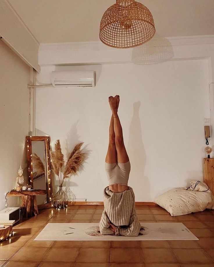 a person doing a handstand in a room