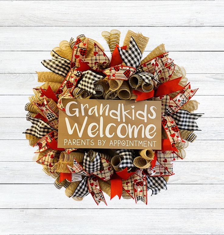 a wreath with the words grandkids welcome parents by appointment written on it in brown and red