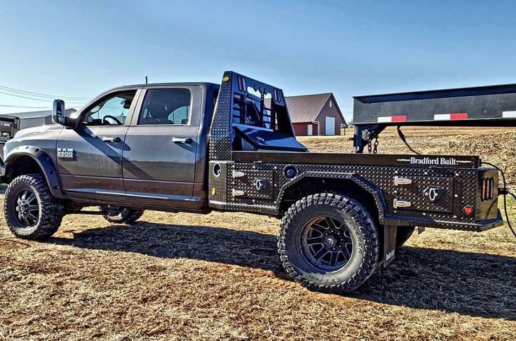 a truck parked in the middle of a field