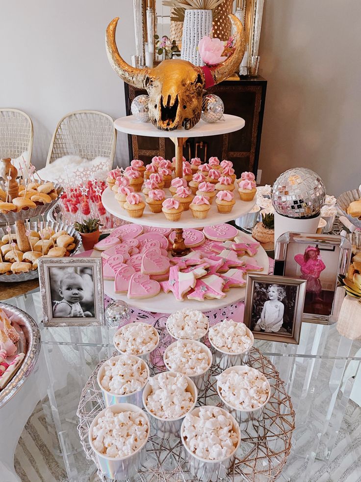 a table filled with lots of desserts and pastries