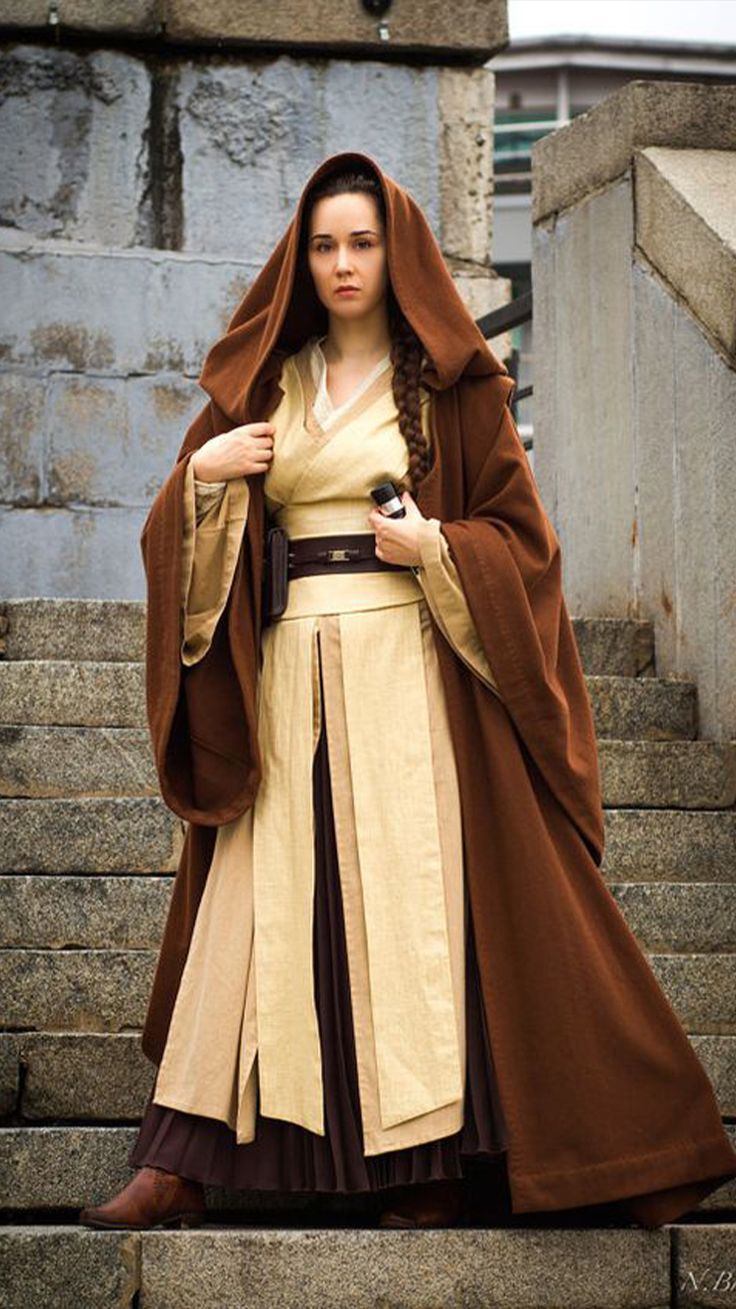 a woman dressed in costume standing on some steps