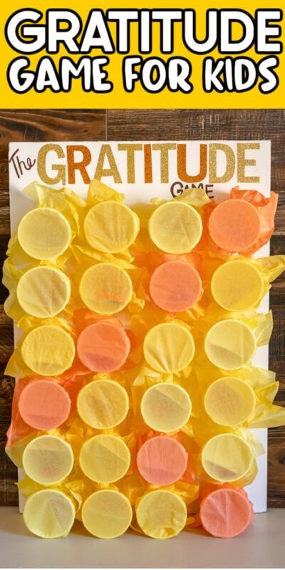 an orange and yellow craft made out of gummy bears with text overlay that reads,'the gratitude game for kids '