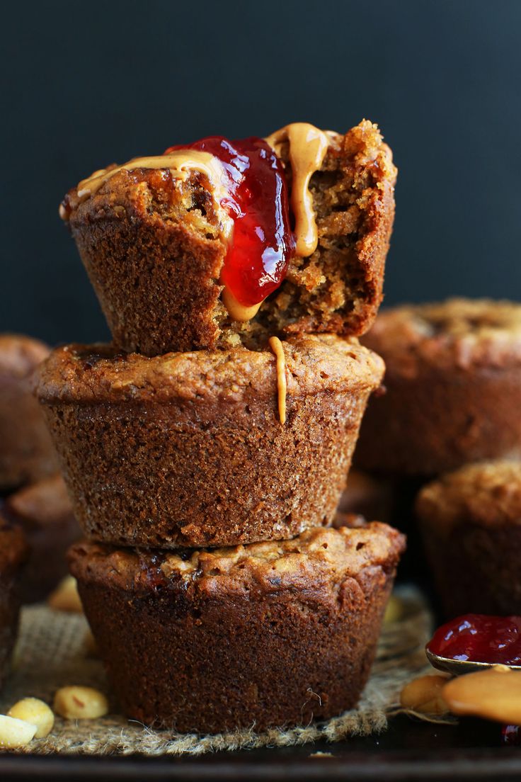 several muffins stacked on top of each other with peanut butter and jelly in the middle