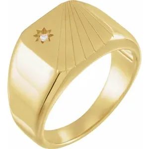 a gold signet ring with a diamond on the center and an arrow in the middle