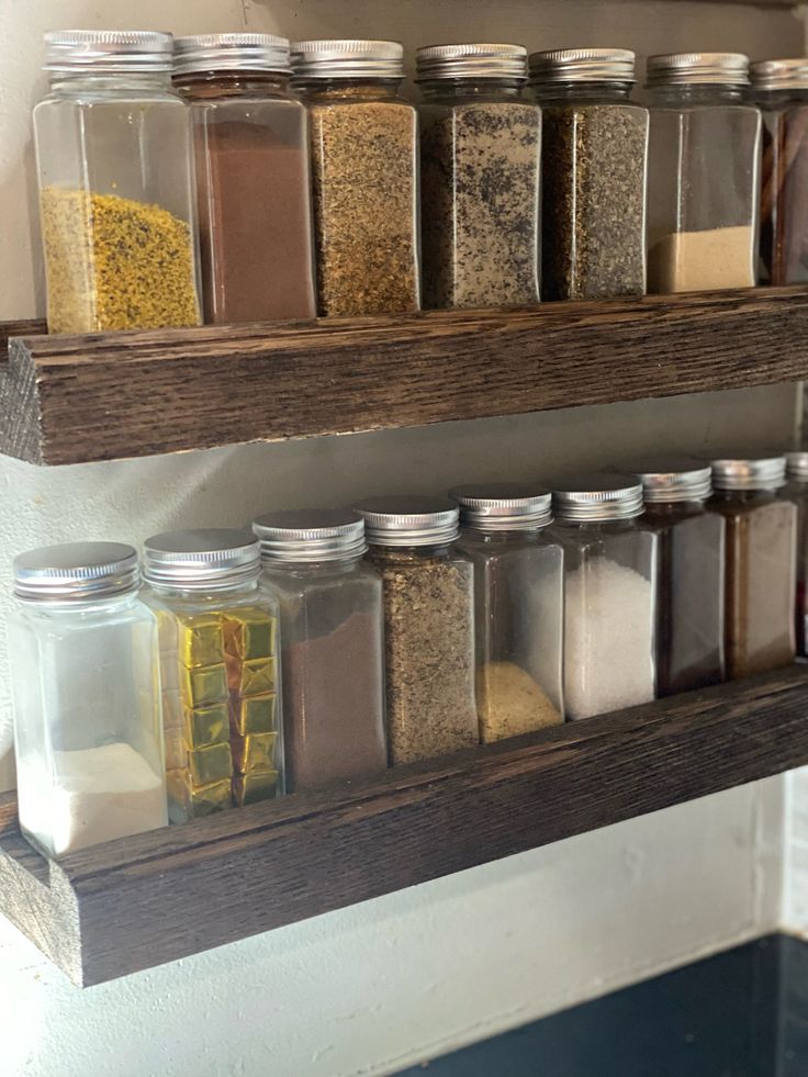 the shelves are filled with different types of spices