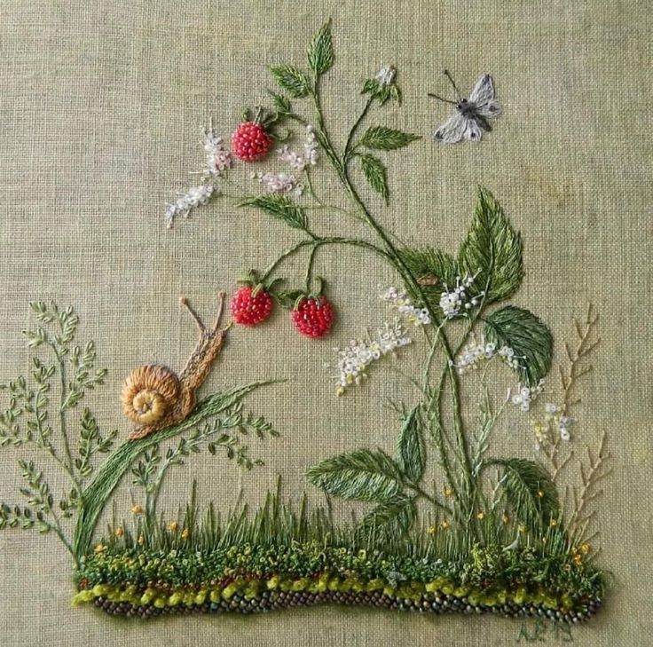 an embroidery work with flowers, leaves and a snail