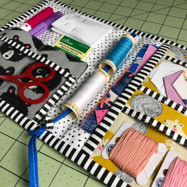 sewing supplies laid out on a table with scissors and thread