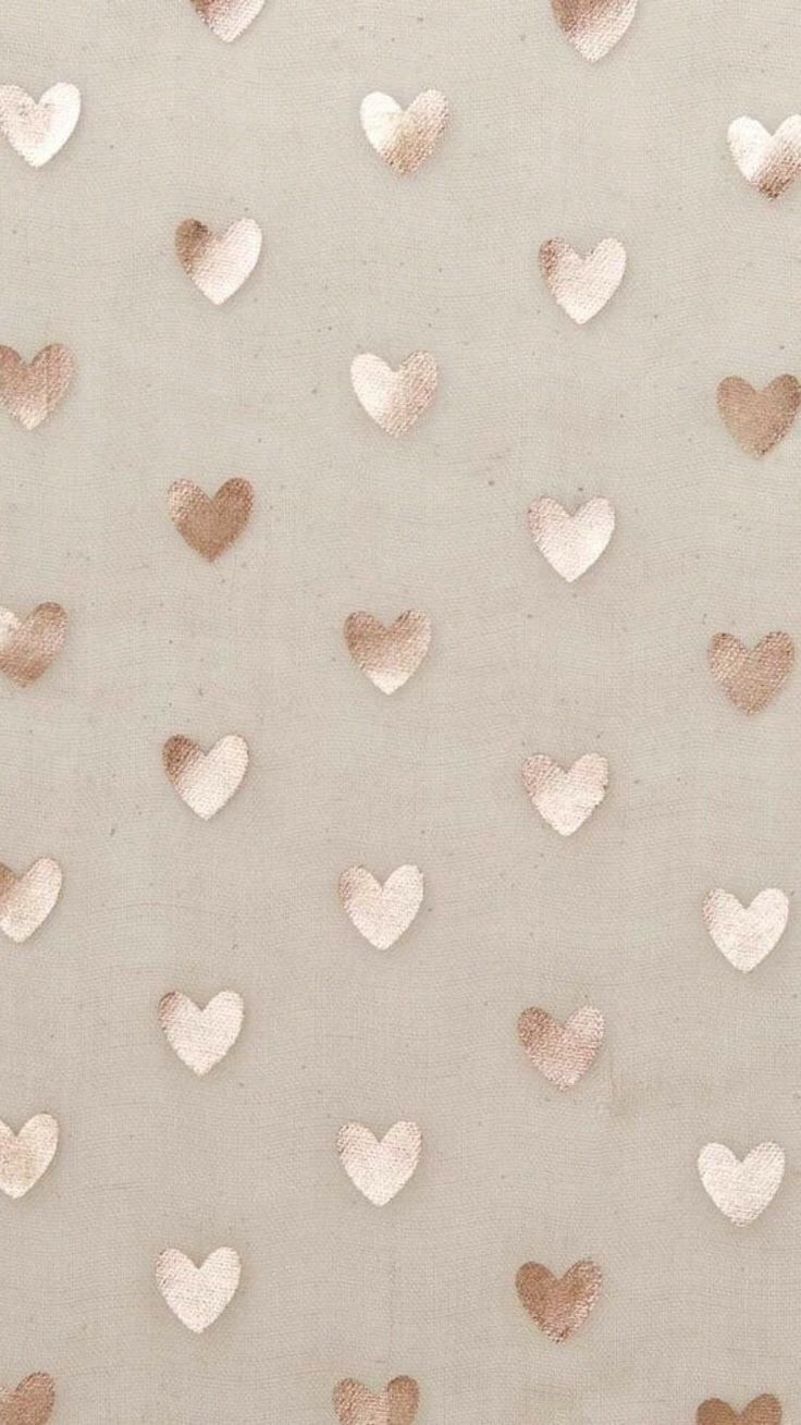 a white and gold wall with hearts on it