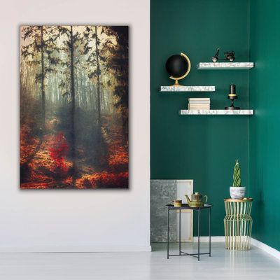 a room with green walls and white flooring, there is a painting on the wall