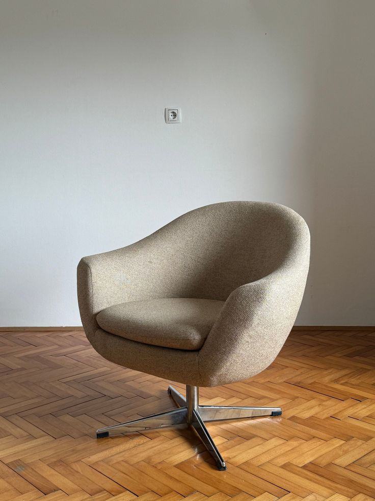 a chair sitting on top of a hard wood floor