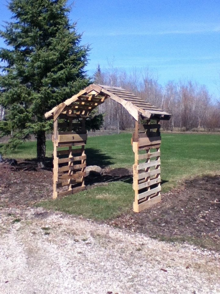 an image of a wooden gazebo in the middle of a field with trees and grass