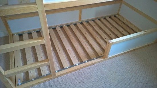 a bunk bed made out of wooden slats