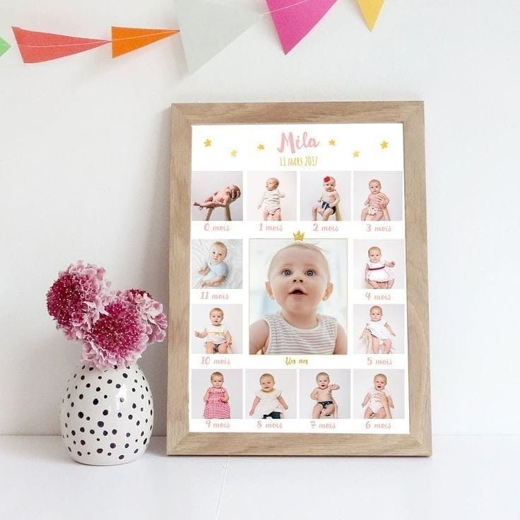 a baby's first year photo is displayed next to a vase with pink flowers