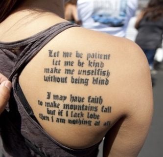 the back of a woman's upper arm with a poem written in cursive writing