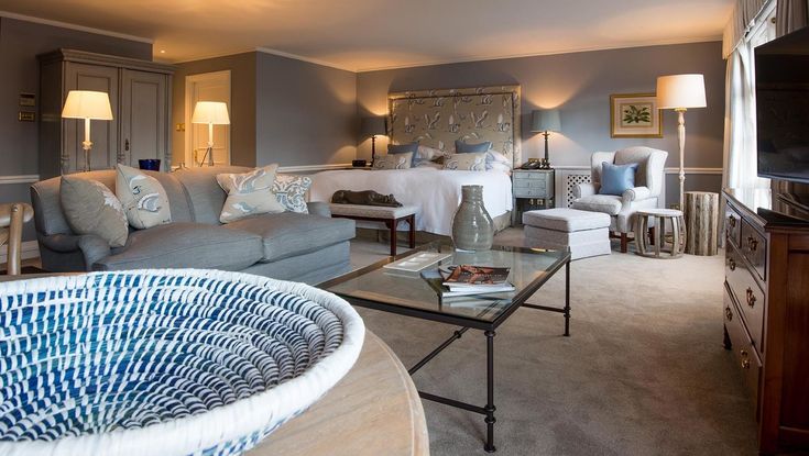 a living room filled with furniture and a flat screen tv