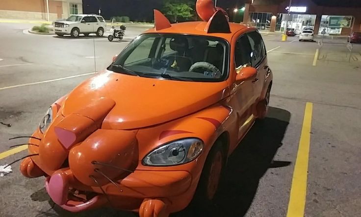 an orange car that is shaped like a cat