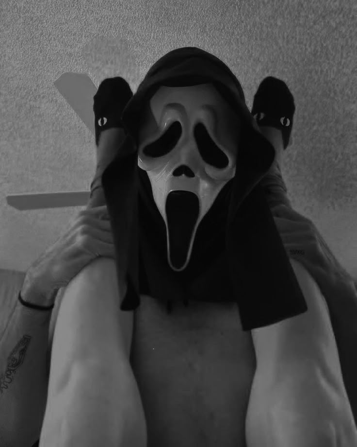 a man wearing a mask with his mouth open