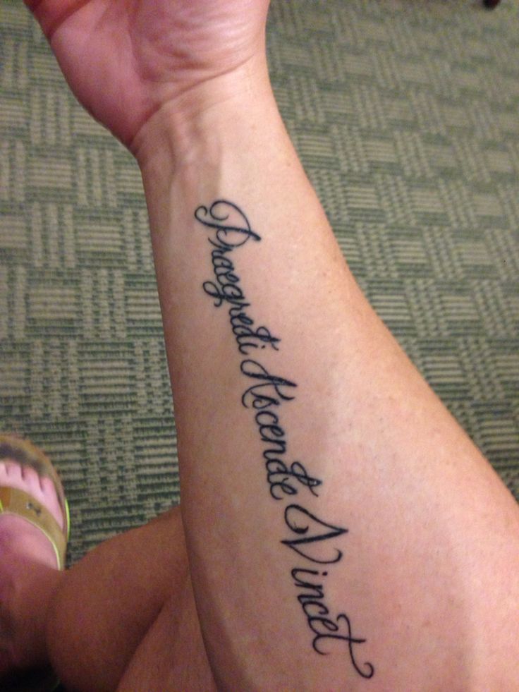 a woman with a tattoo on her arm that says, i am not afraid to see the