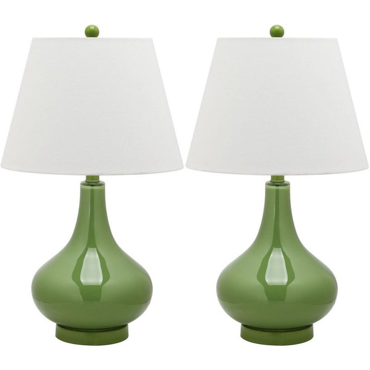 two green lamps sitting next to each other on top of a white table lamp shade