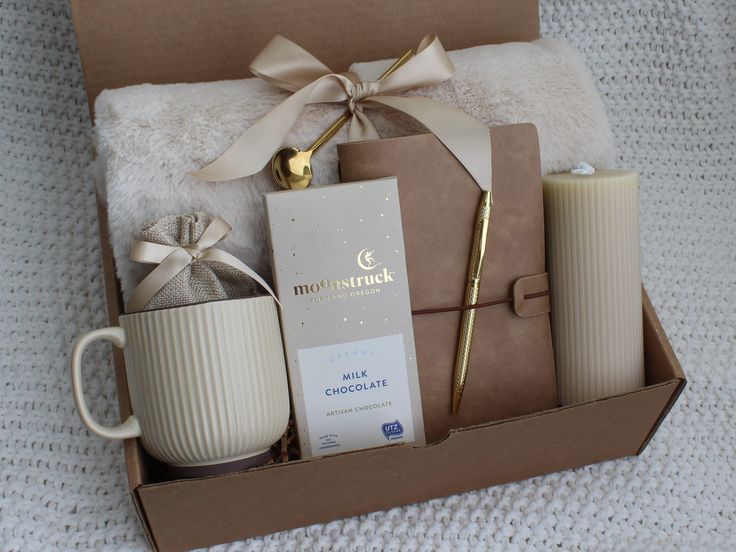 an open box containing coffee, candles and other items