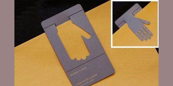 a pair of gloves cut out from a card