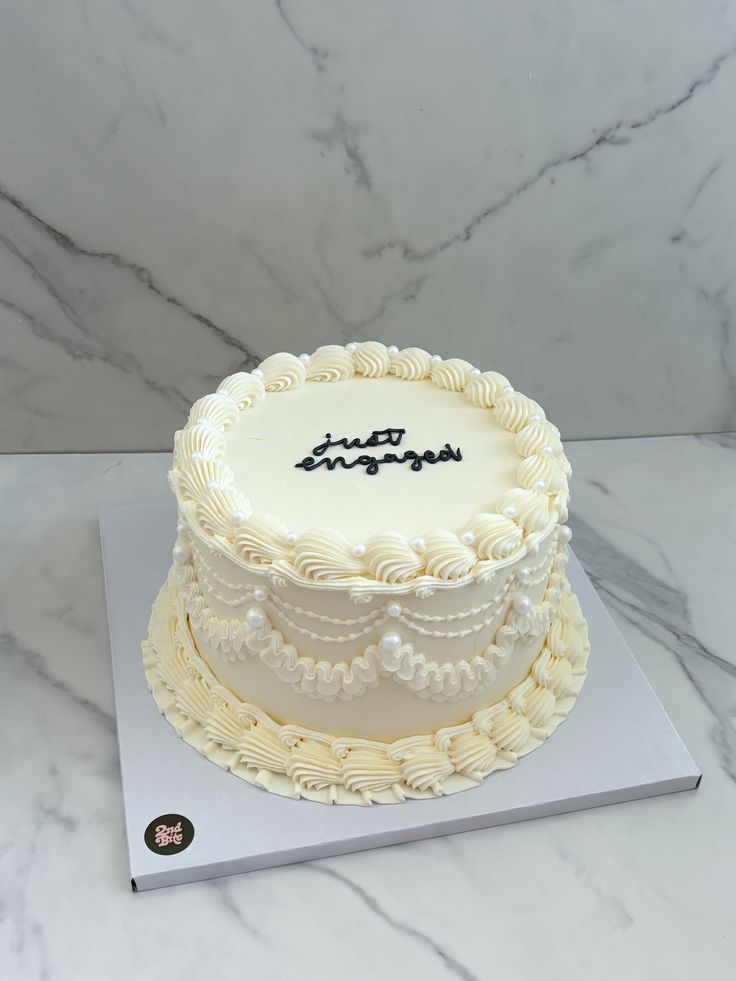 a white cake sitting on top of a table