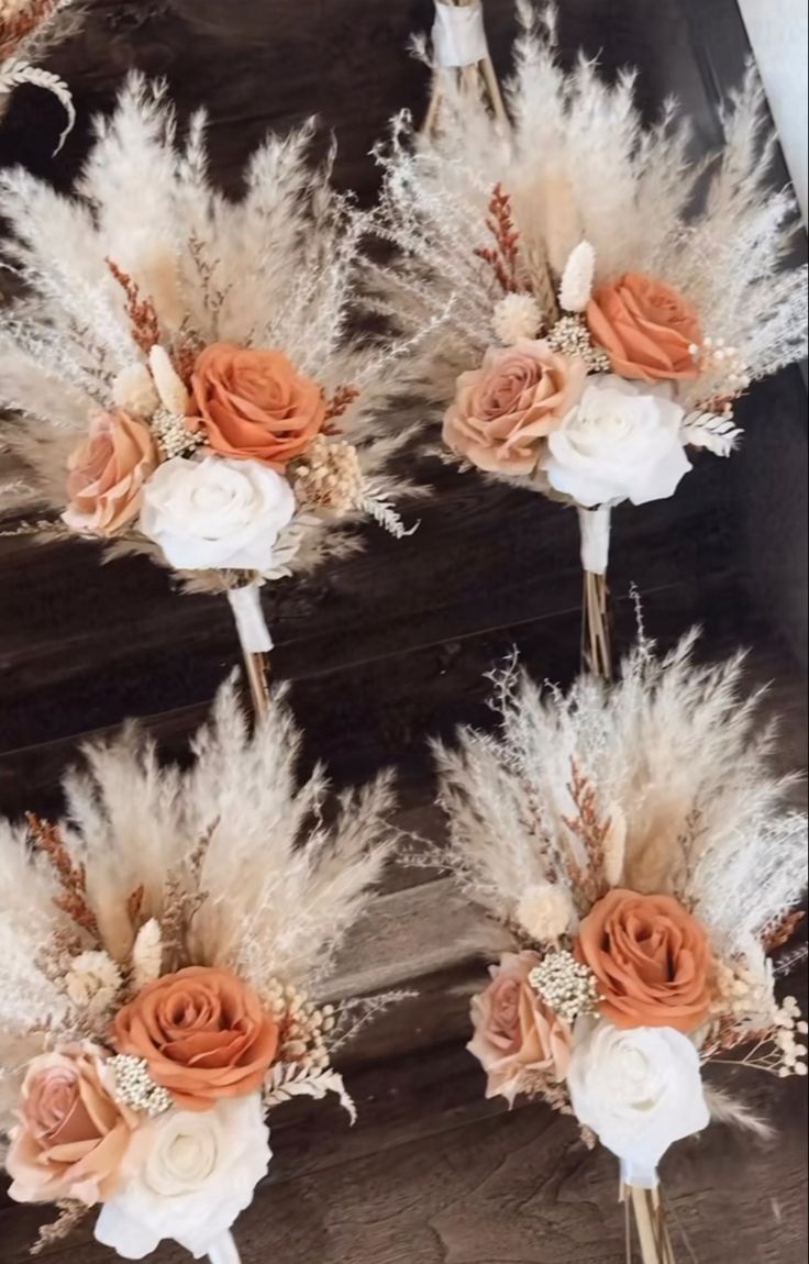 wedding boutonnieres with dried flowers and feathers