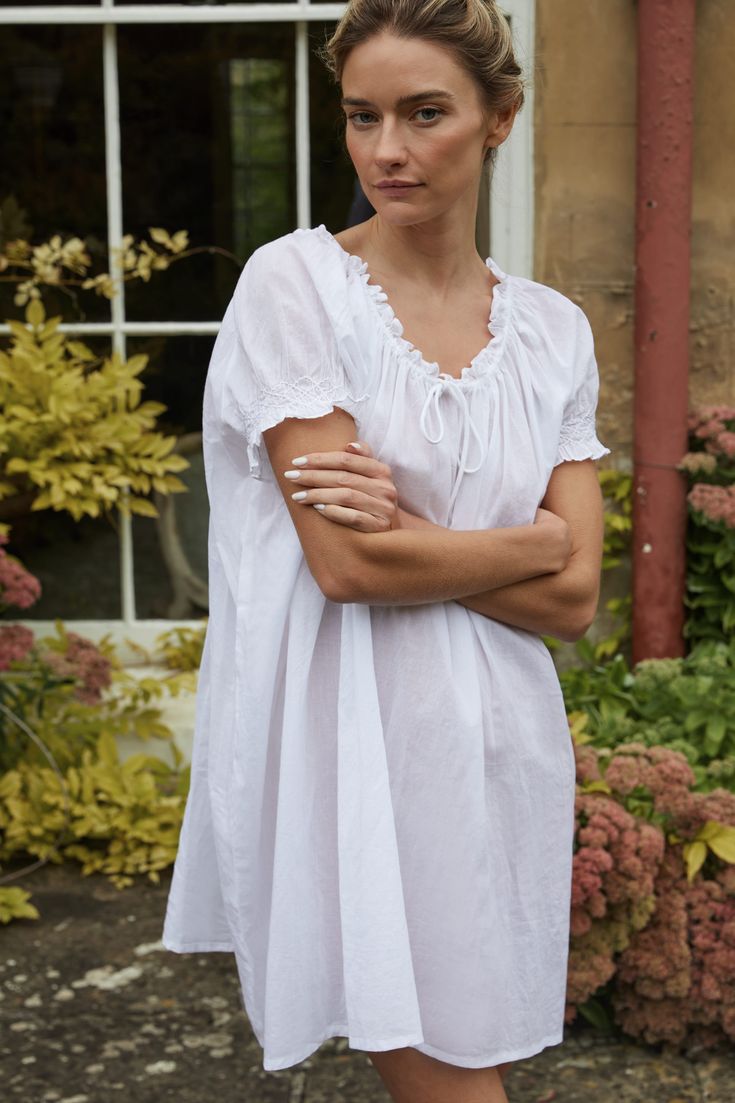 A family business, If Only If is obsessed with the classic nightgown from its timeless silhouette to the most special details. Crafted in 100% natural materials, these nightdresses are romantic, practical, and become even softer with every wash. Crafted from soft cotton, the Clover Smocked Cotton Voile Nightdress is made specially for those sultry summer nights. Featuring an adjustable drawstring neckline, and hand-smocked cap sleeves, it's a warm weather dream come true. Product Details 100% GO Lounge Wear Dress, Linen Nightgown, Cotton Night Dress, White Nightgown, Babydoll Nightgown, Drawstring Neckline, Cotton Nightgown, Pajama Dress, Cotton Sleepwear