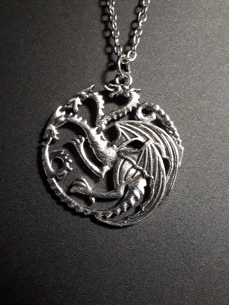 Silver plated Dragon pendant on a silver plated 20 inch chain. Dragon Fashion, Silver Celtic Rings, Celtic Knot Earrings, Pretty Beads, Horses Pendant, Dragon Pendant, Knot Earrings, Red Rhinestone, Multi Strand Necklace