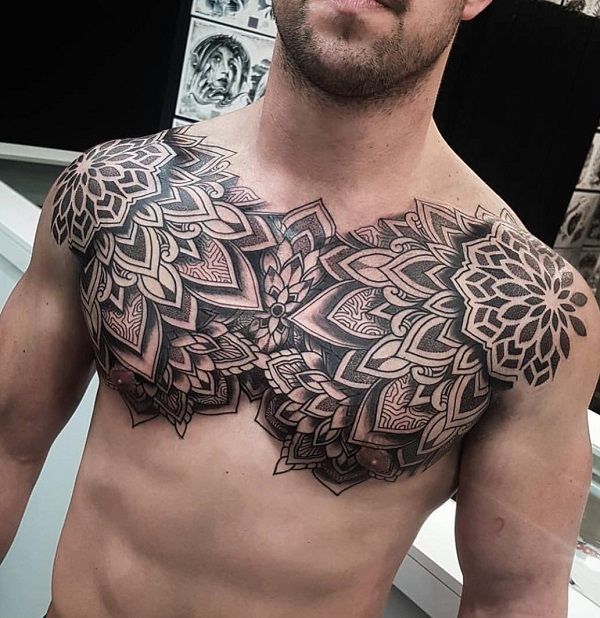 a man with a tattoo on his chest