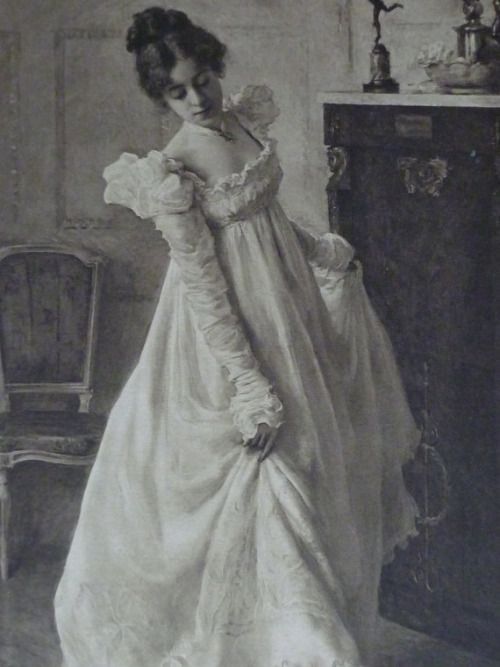 an old photo of a woman in a dress