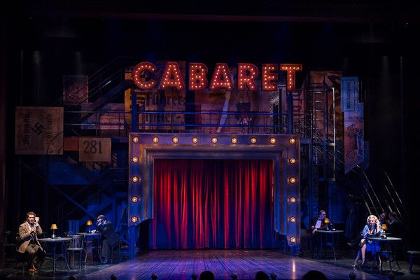 the cast of cabaret on stage during a performance