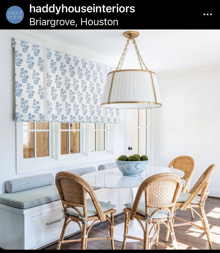 the dining room table is set with four chairs