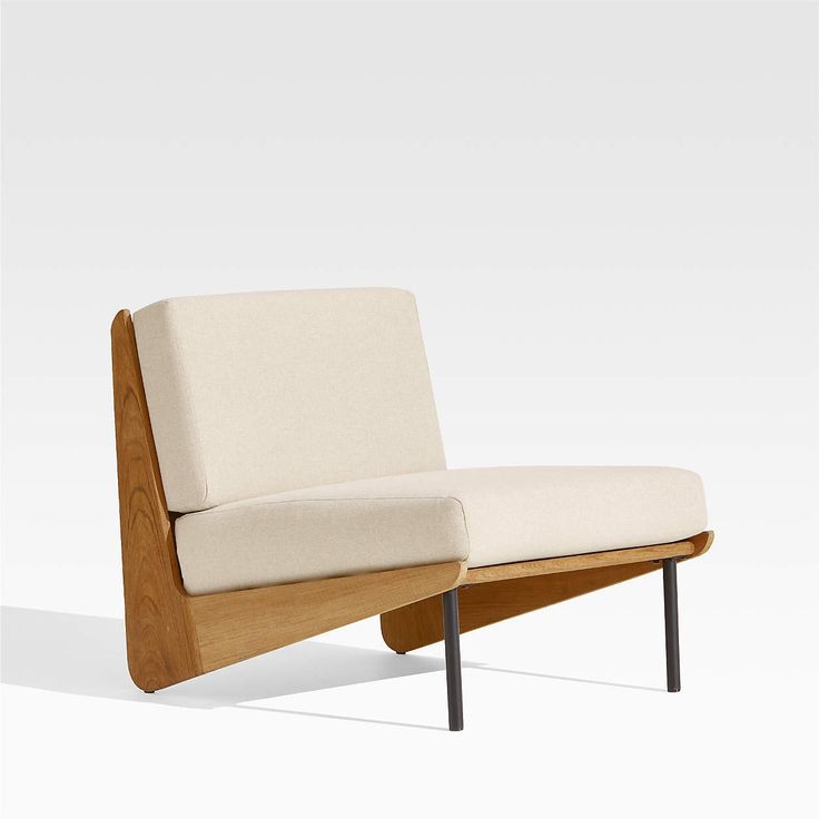 a chair with a wooden frame and white fabric upholstered on the armrests