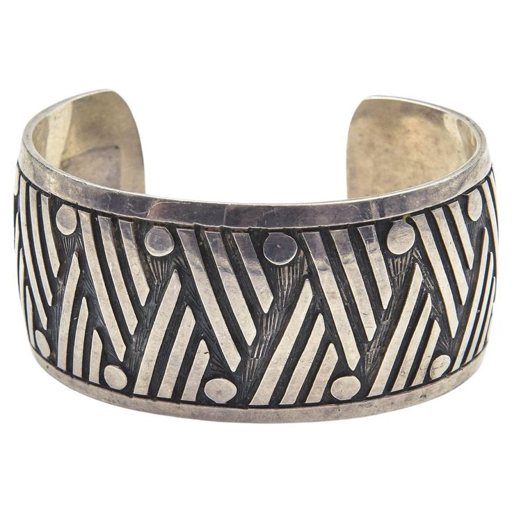 Highly stylized geometric design Mexican sterling silver cuff bracelet. Interior circumference measures 5 3/4". It is 32.68 mm wide top to bottom. Marks include "Mexico" and "925." Chanel Cuff, Gold Cuffs, Sterling Silver Cuff Bracelet, Tiffany And Co, Sterling Silver Cuff, Silver Cuff Bracelet, Leather Cuffs, Silver Cuff, Silver Bracelets