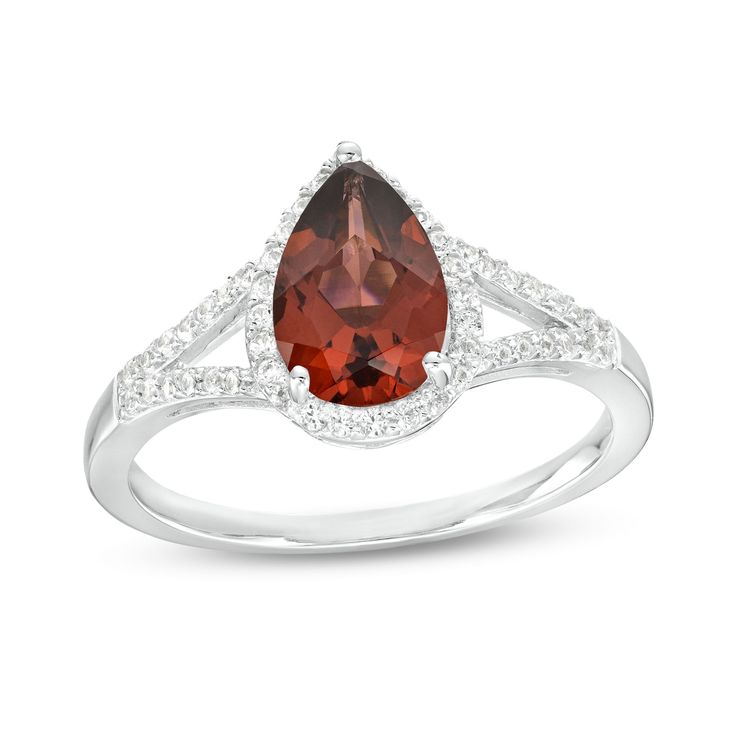 Bring alluring color to any look when you wear this pear-shaped red garnet and white lab-created sapphire frame split shank ring in silver. Fashioned in sterling silver This choice glistens with a 9.0 x 6.0mm pear-shaped regal red garnet at the center. White lab-created sapphires line the halo frame and the ribbons of the split shank for added shimmer. Garnet is the traditional birthstone for January and symbolizes friendship, loyalty and devotion. Ring Board, Split Shank Ring, White Lab, Split Shank, Sapphire Stone, Red Garnet, Stone Settings, Pear Shaped, Birthstone