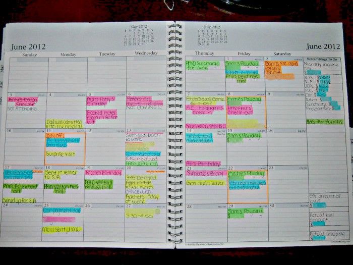 an open planner with colorful notes on it