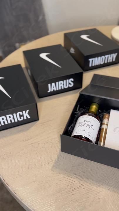 three bottles of wine are sitting on a table with two black boxes that say, patrick and jarrick