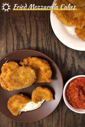 fried mozzarella cakes on a plate with tomato sauce and ketchup next to it