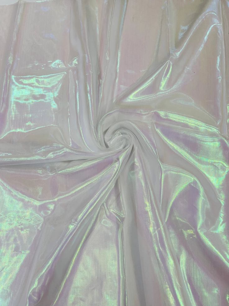 the fabric is shiny and has been dyed in pastel green, pink or blue