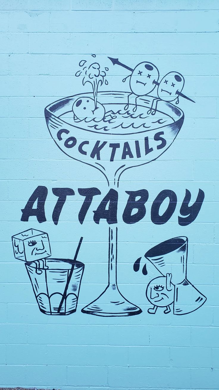 graffiti on the side of a building that says cocktails attaboy and drinks