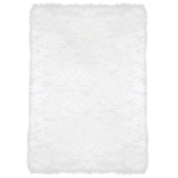 a white rug with fluffy fur on the top and bottom, it is very soft