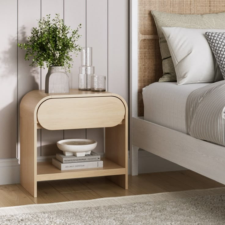 Width: 21.9 inches Height: 22 inches Length: 13.8 inches Introducing the Iris Nightstand – where timeless elegance meets modern charm! With its arched corners and rounded-edge silhouette, this nightstand boasts a sleek, mid-century modern style that effortlessly complements any space. The rounded drawer front adds a touch of playful sophistication, while its versatile design makes it a perfect addition to your bedroom, living room, or any tranquil oasis you call home. Elevate your space with the Light Oak Bedroom Furniture, Desert Twilight, Twilight Color, Night Stands Bedroom, Bedside Table Styling, Round Nightstand, Tall Nightstands, Storage Furniture Ideas, Mid Century Modern Nightstand