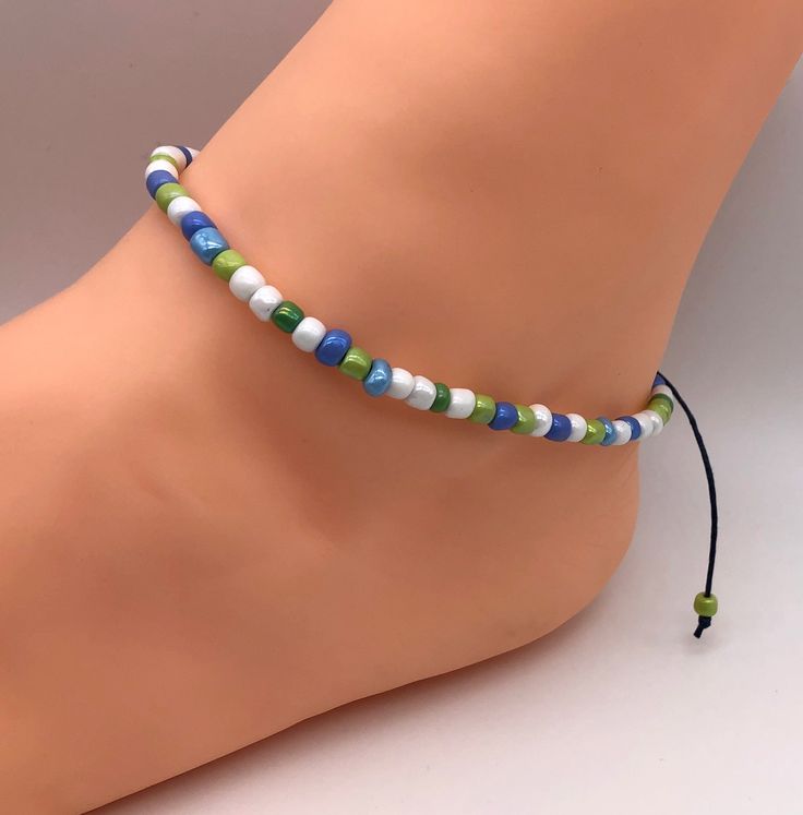 Blue, green and white beaded anklet - a lovely combination £6.50 https://etsy.me/2NlPq8y Surfer Jewelry, Leather Anklets, Anklet Designs, Beaded Anklet, Hanging Beads, Ankle Chain, Beaded Anklets, Bracelet Ideas, Ankle Bracelet