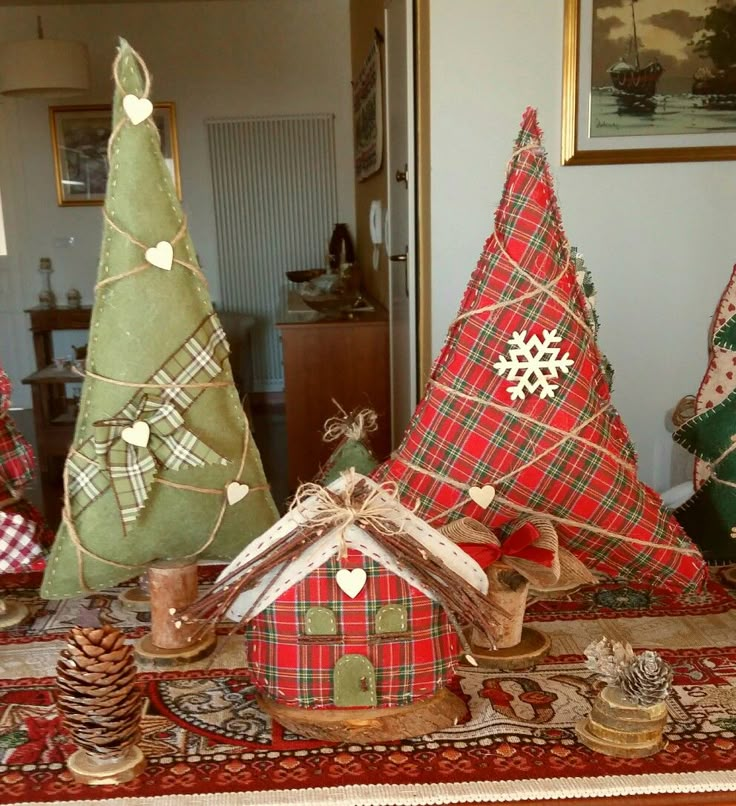 christmas trees and other holiday decorations on a table